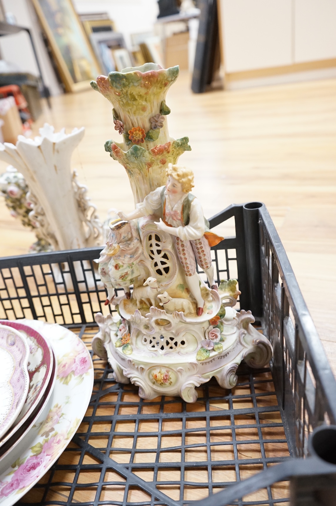 A German porcelain figural centrepiece, lobed dish, three other plates and two others